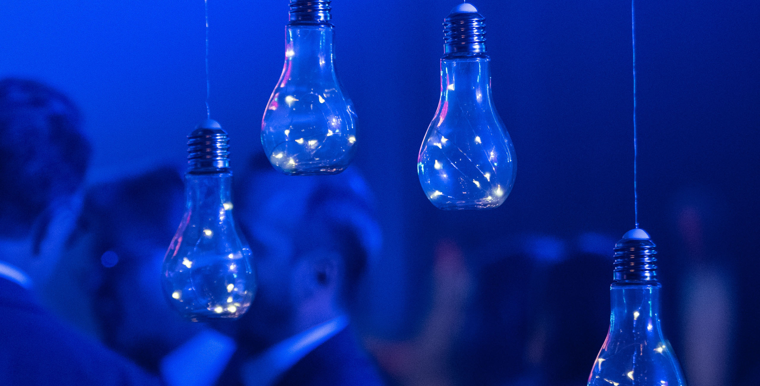 Lightbulbs hanging with blue background